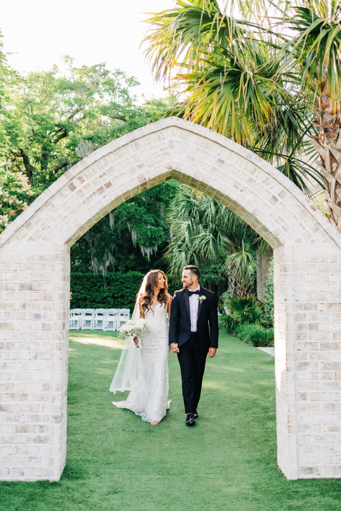 Couple walking at Wrightsville Manor after saying I do