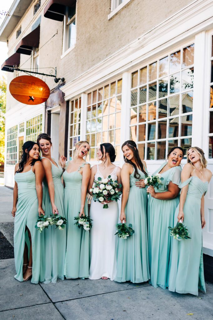 Bride and her bridesmaids laughing at Bakery 105