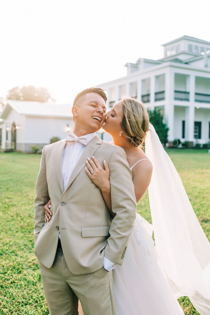 Bride kisses groom at Union Valley Farm and Vineyard