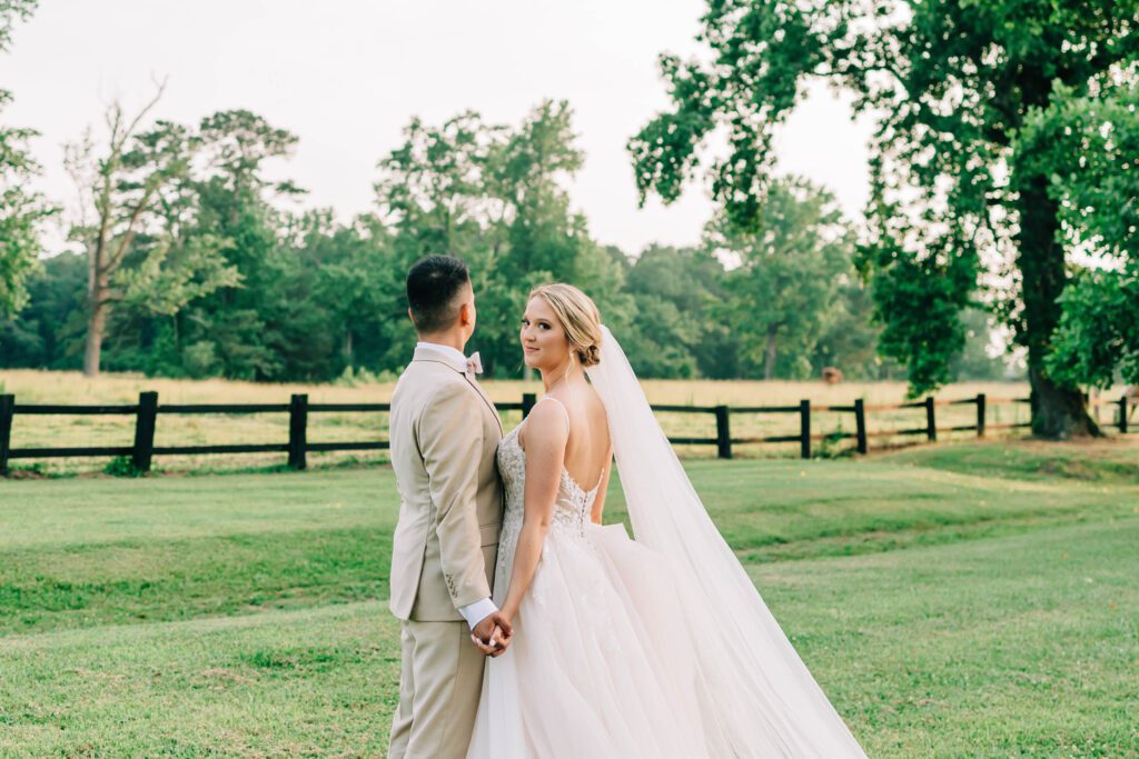 Bride and groom hold hands after saying I do at Union Valley Farm and Vineyard